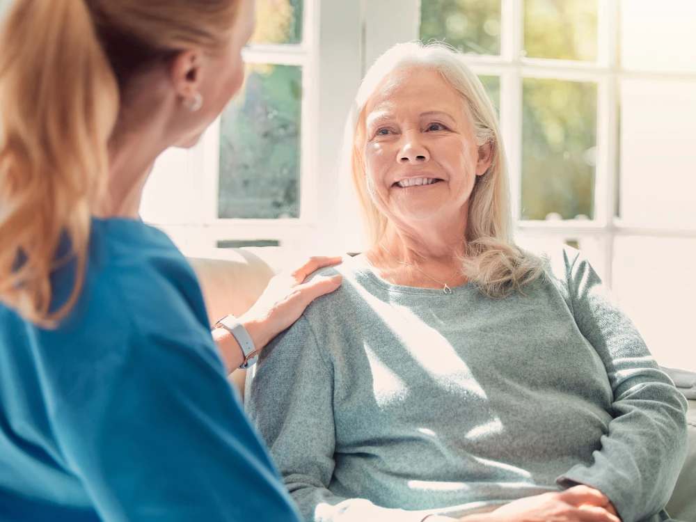 Pharmacist speaking with an older adult about medication care