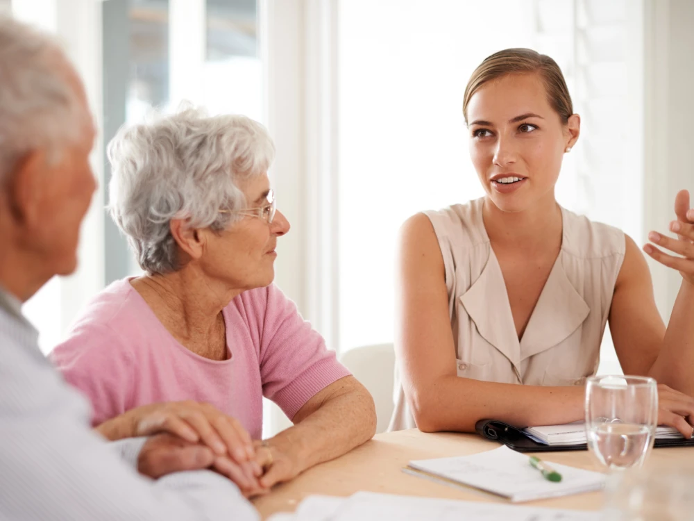 Health professionals discussing medication use in an aged care setting